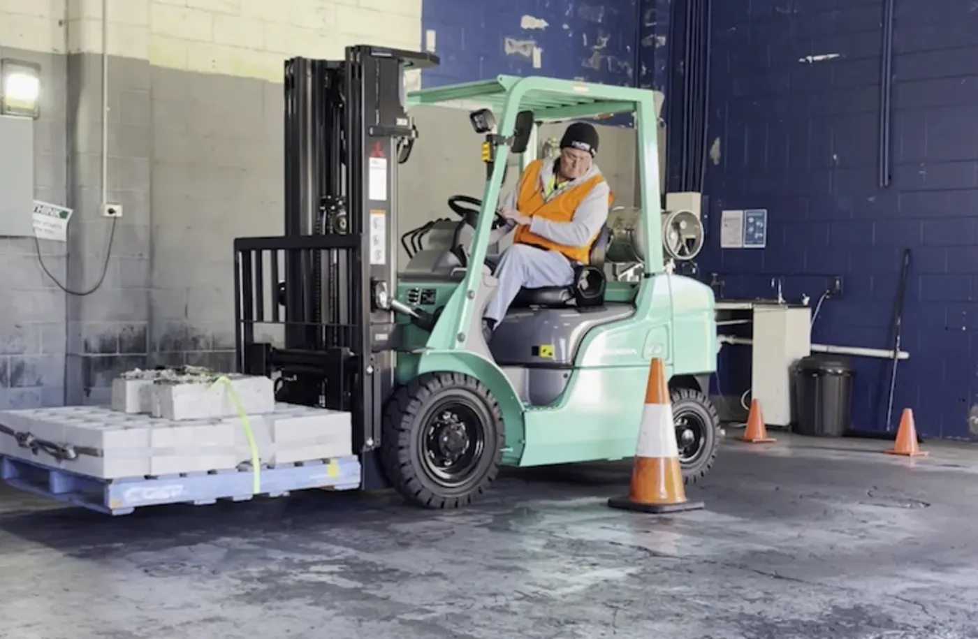 Student operating a forklift during practical training